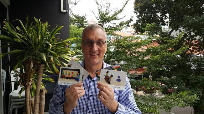 Gred holding up LEGO for education stategic cards