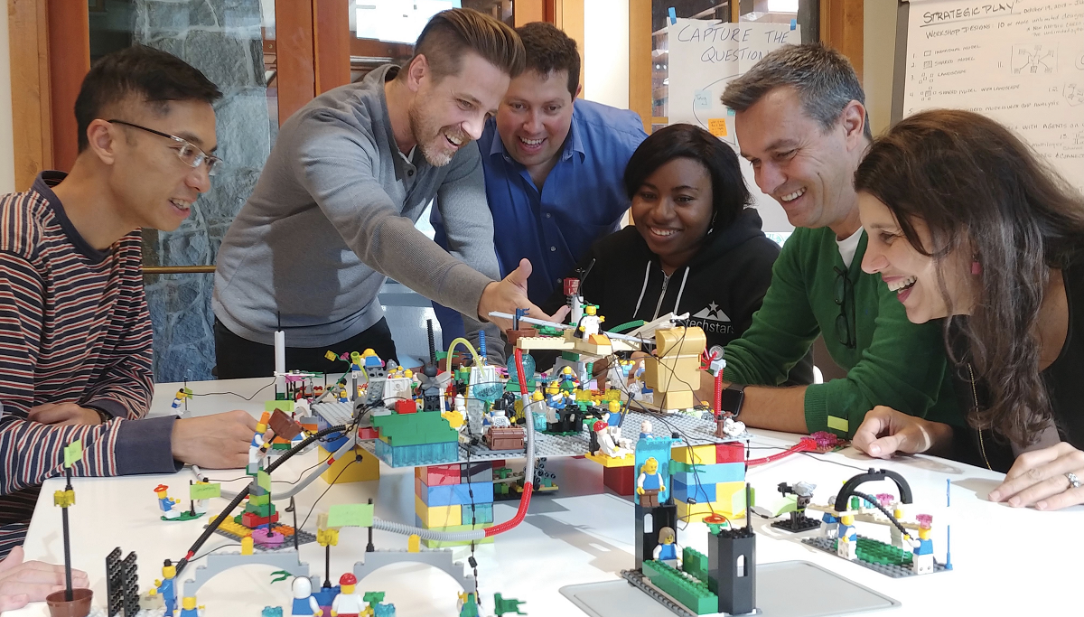 LEGO Teambuilding event, group observes ideas during training event